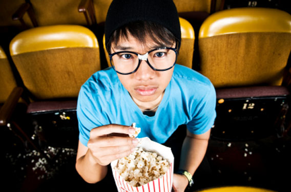 Nerdy guy at a movie theatre