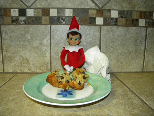 Elf on the Shelf eating a muffin