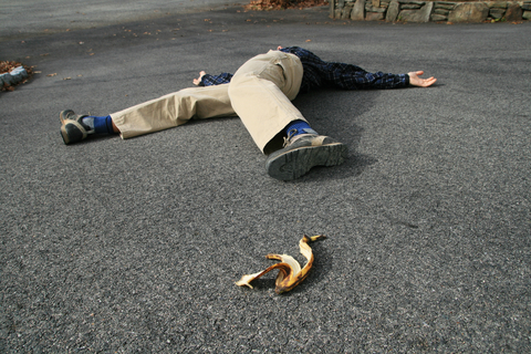 Man fell down after slipping on a banana peel